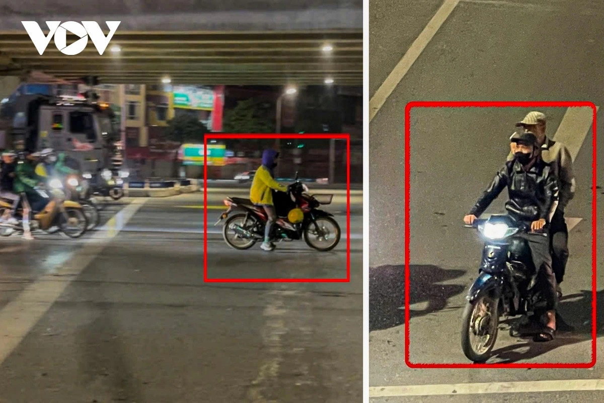 Dem ha noi, duong vang nhung xe co van deu tam tap truoc vach ke dung den do hinh anh 10