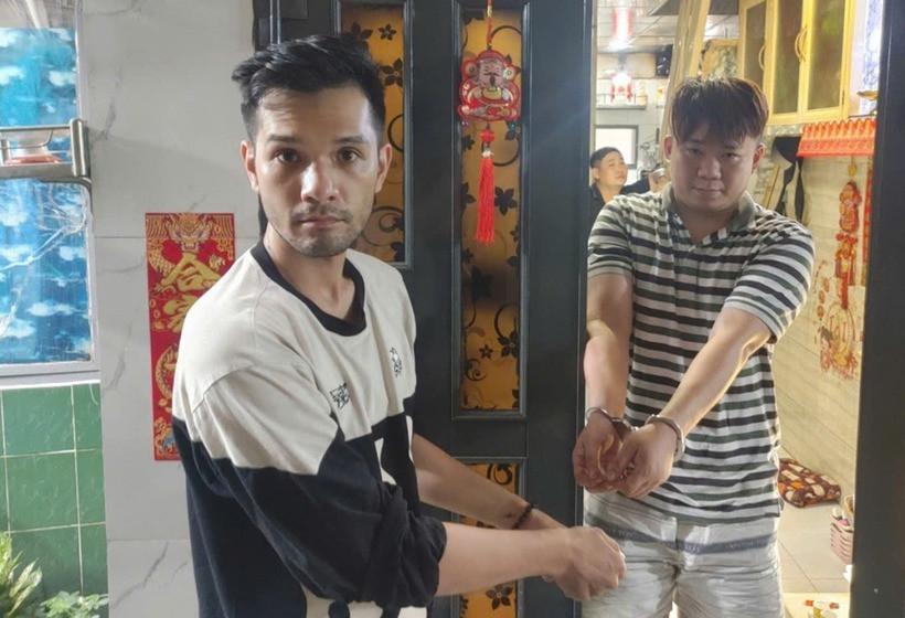 Nhikolai Đinh (bìa trái) thời điểm bị bắt. (Ảnh: Cơ quan công an)