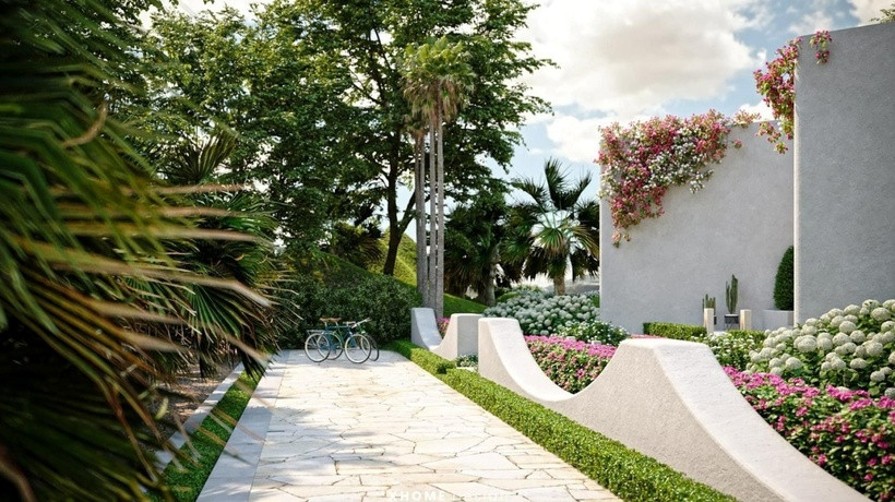 Không gian xung quanh ngôi nhà vô cùng thoáng đãng, tràn ngập cây xanh và hoa tươi.