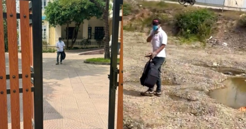 Người dân quay lại cảnh nghi phạm xách túi đựng tiền đi bộ ra ngoài (Ảnh: Chụp màn hình).