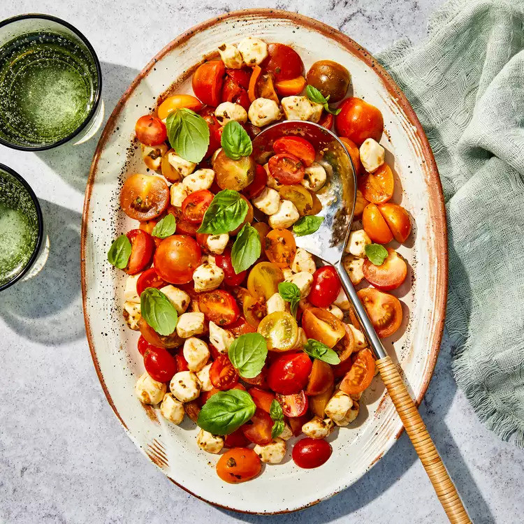 caprese salad with cherry tomatoes 202aa30c8f8b40c6881085abc15982d7