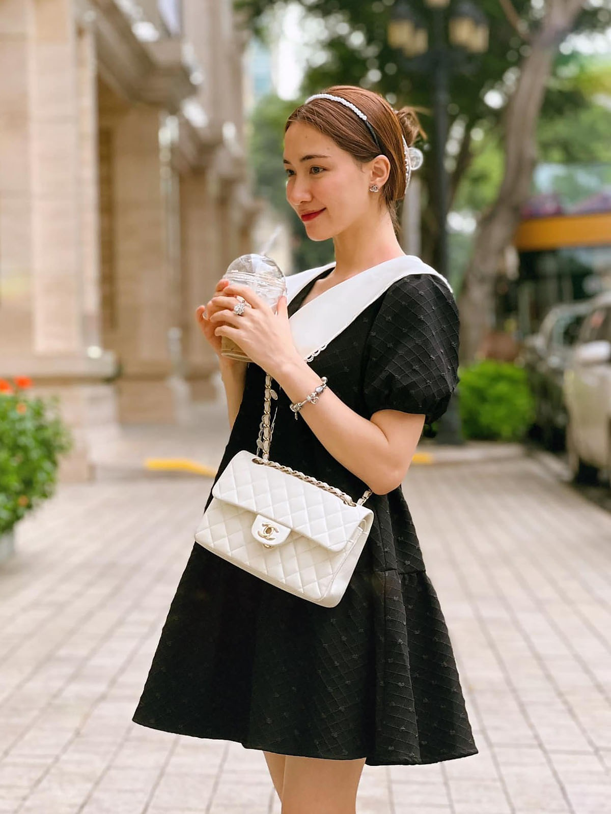 Hòa Minzy xách túi gần 200 triệu chủ tịch tặng vi vu nước Nga