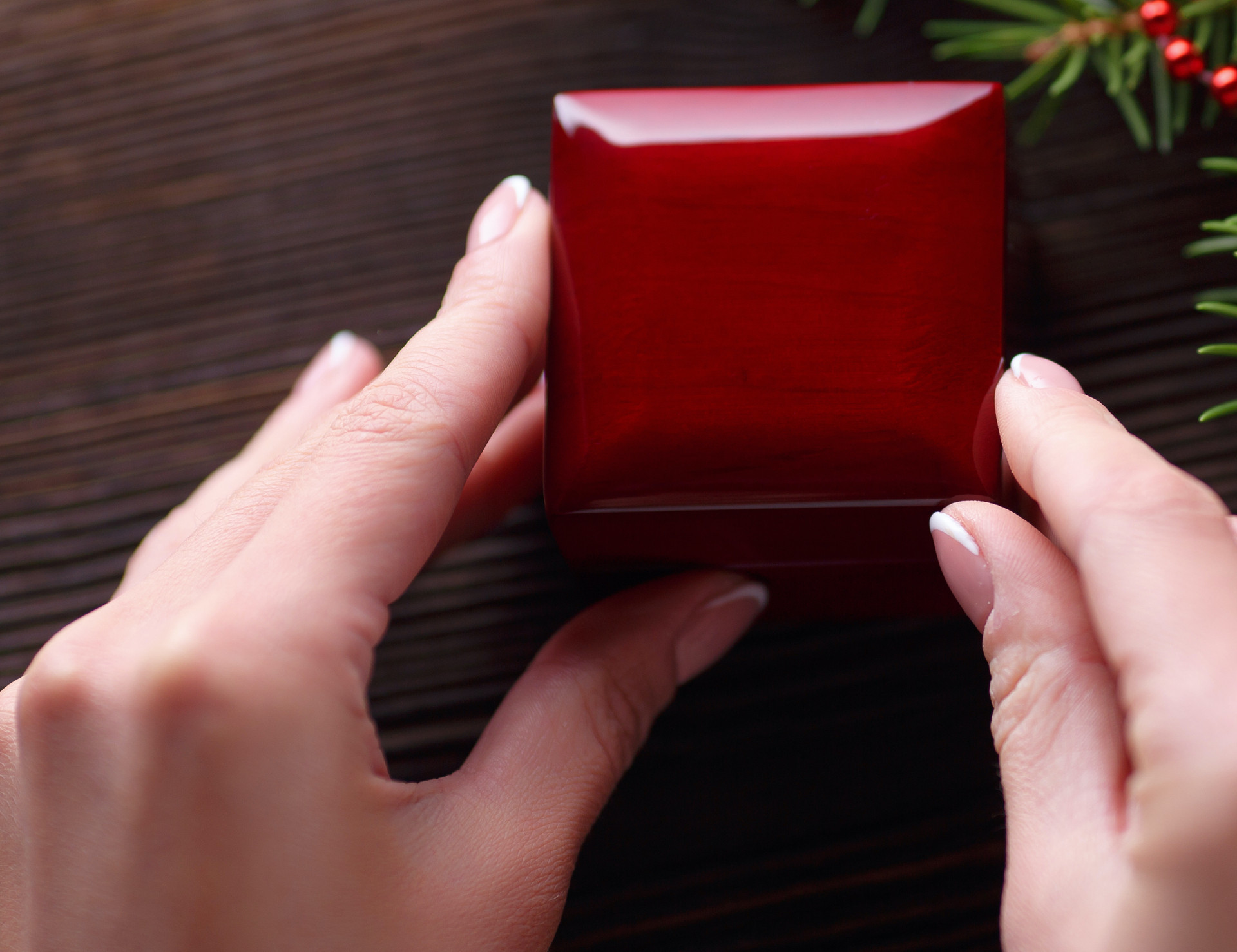 hands holding closed red box (2).jpg