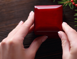 hands holding closed red box (2).jpg