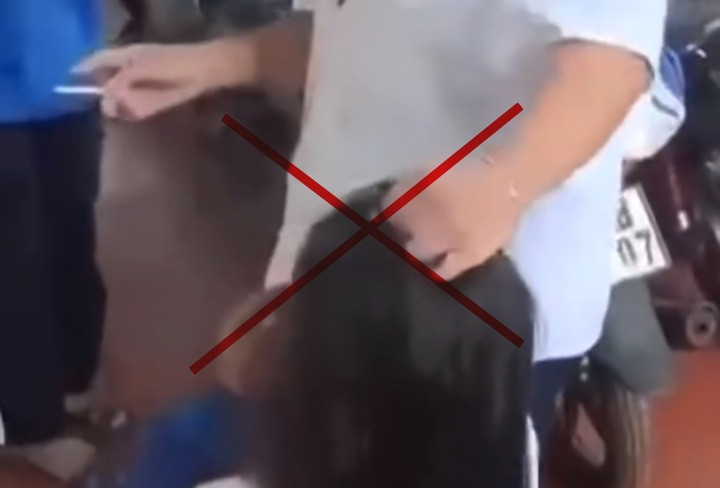 Cảnh nữ sinh bị túm tóc, bắt quỳ gối (ảnh cắt từ clip)