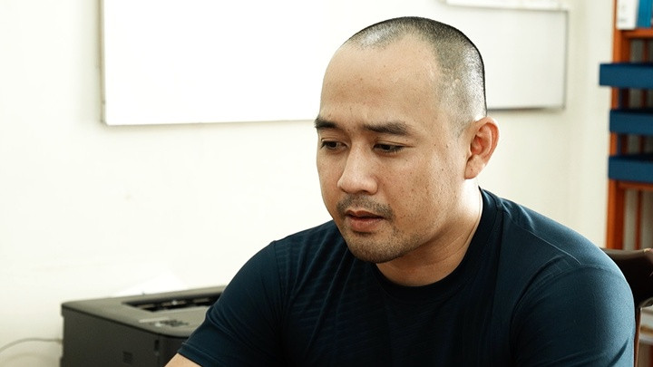 Bị can Đặng Phan Thanh Tùng sau khi bị bắt.