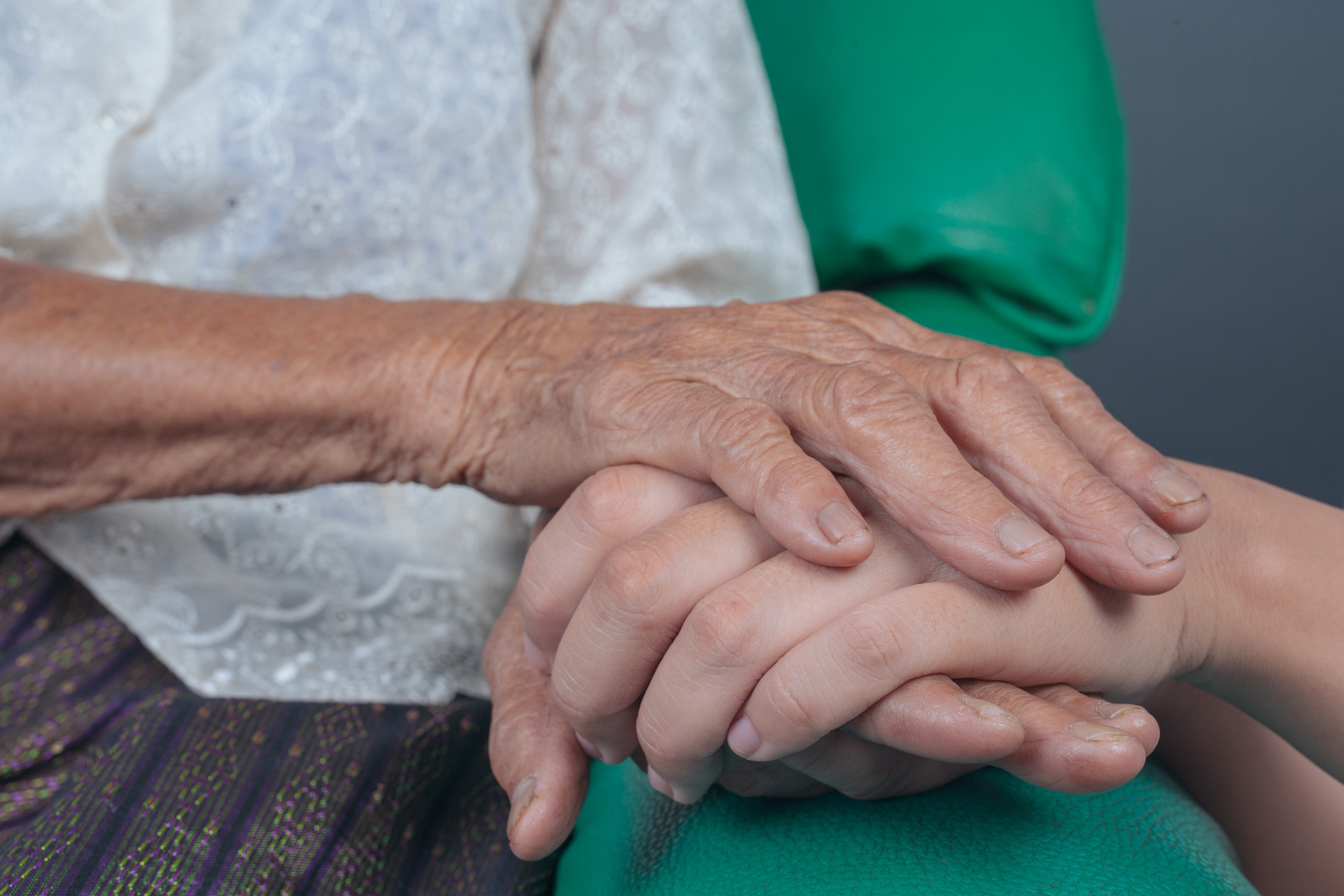 young woman holding elderly woman s hand.jpg